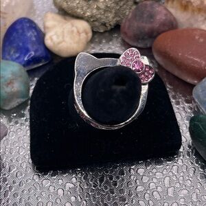 3.16.26-18 Silvertone Hello Kitty Cat Ring with Pink Crystal Accents Size 6